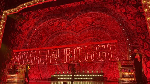 Actors in Moulin Rouge! The Musical dance across the stage before the show starts.