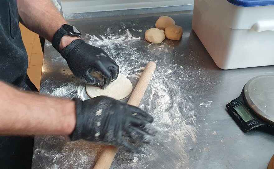 The two key things to rolling out the dough are, 1) don't make it too big, and 2) make a flattened corona around the edge to made the center thicker in order to prevent leakage.