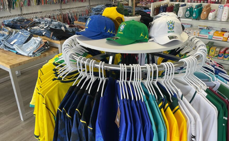 Brazilian shirts and hats inside a store. 