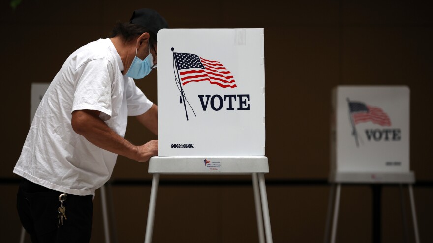 A voter fills out his ballot during early voting at the Santa Clara County Registrar of Voters office last week in San Jose, Calif.