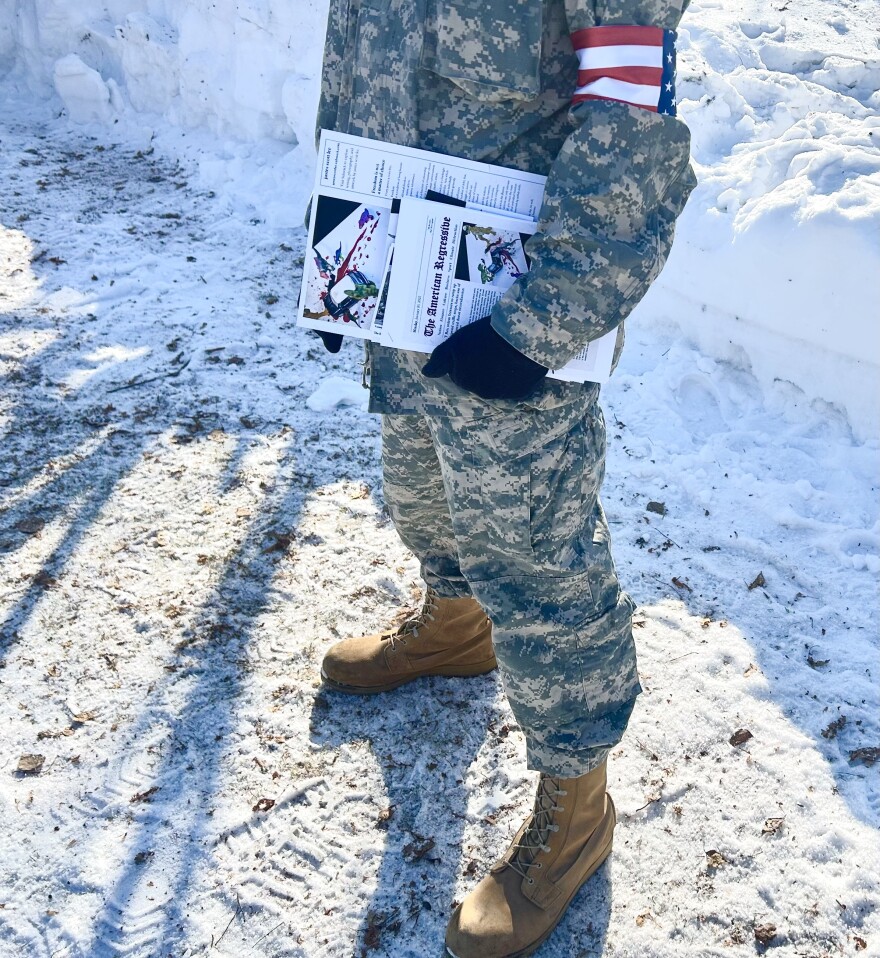 Scott Justesen hands out copies of his zine at a No Kings protest in Fairbanks on March 28, 2026.