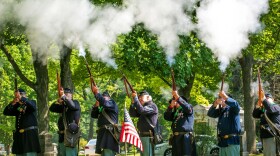 A Sons of Union Veterans of the Civll War honor guard fires a volley during the new gravestone ceremony for Corporal Lyman Snow at Oakwood Cemetery Monday morning in Traverse City. Snow, a veteran of the Mexican-American War and Civil War, received a Veterans Administration headstone this year after 111 years of his grave being unmarked.