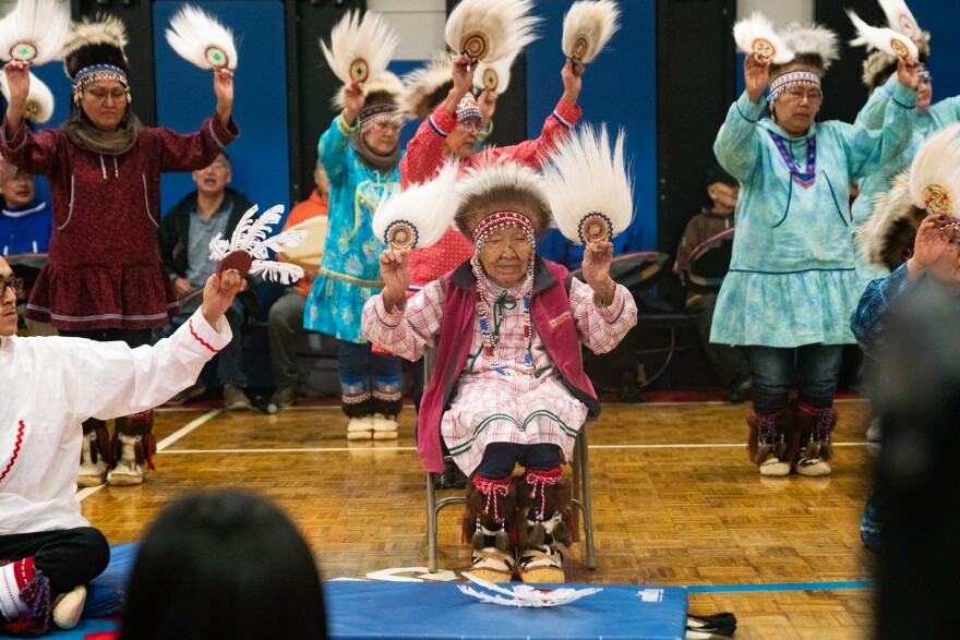 Lizzie Chimiugak Nenguryarr (center), the first person counted for the 2020 census, joins in the Yup'ik dancing at the ceremony on Tuesday.