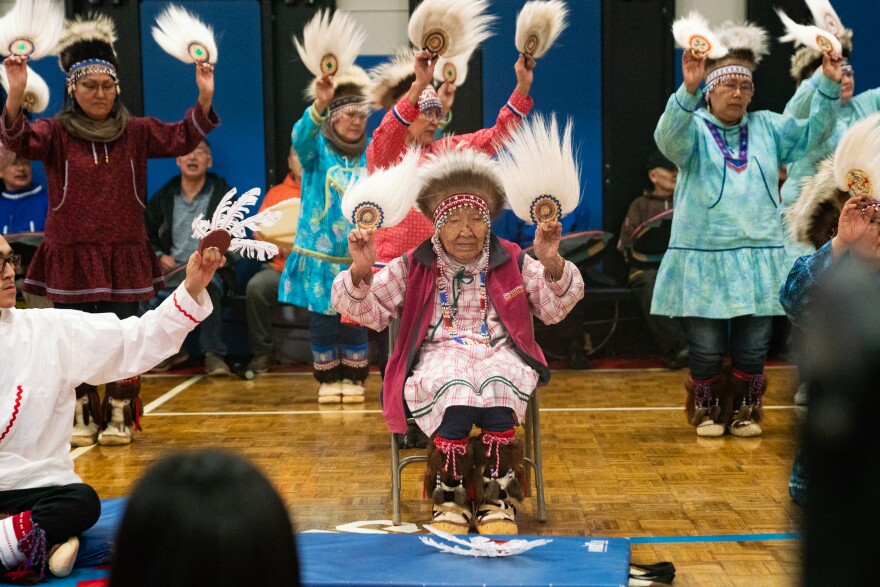 Lizzie Chimiugak Nenguryarr  (center), the first person counted for the 2020 census, joins in the Yup'ik dancing at the ceremony on Tuesday.