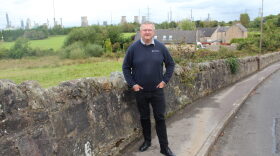 Reid R. Frazier / StateImpact Pennsylvania Kevin Ross, president of the Scottish Plastic and Rubber Association, in front of the INEOS Grangemouth refinery and chemical plant.