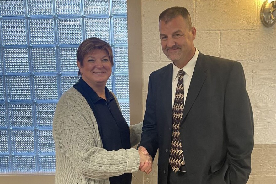Randy Maxwell, right, shakes hands with Indiana Republican Party chair Anne Hathaway after his election to the state Senate by a private Republican precinct caucus.