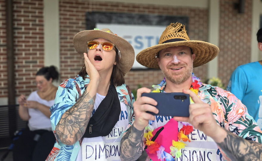 Orlando residents Dusti Meeks and Ryan McDaniel assume the personas of "Orlando Tourists" at Franco's Flop Fest in Baldwin Park.