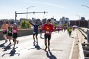 Nate Kahaialiʻi, center in red, just completed the New York City Marathon with a sub-four-hour time, getting shakas and cheers for Lahaina along the way. (Nov. 3, 2024)