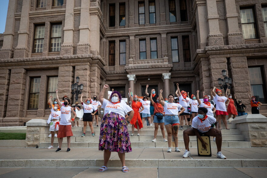  Opponents of Senate Bill 8, the restrictive Texas abortion law, protest outside the Texas Capitol. 