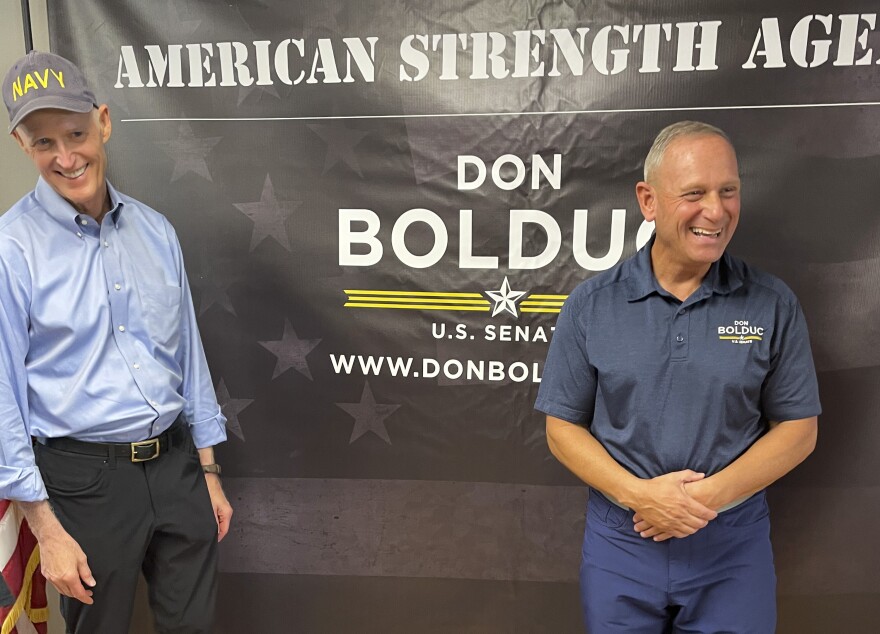 Sen. Rick Scott, R-Fla., chairman of the National Republican Senatorial Committee, campaigns alongside New Hampshire Republican Senate candidate Don Bolduc in Atkinson, N.H. on Sunday, Oct. 30, 2022. (AP Photo/Steve Peoples)