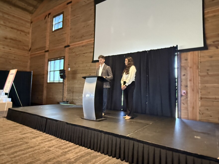 Christopher Kappin and Sydney Bartunek speak at a press conference announcing the new company Solace on Oct. 09, 2025.