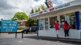 Customers place the ice cream order at Zip Dip on Harrison Avenue as restaurants and bars begin to reopen in the wake of the Coronavirus COVID-19 pandemic, Saturday, May 16, 2020, in Cincinnati.