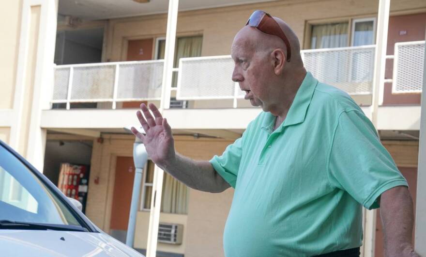 David Semrau waves goodbye to his friends, Diane Burrelsman and Chuck Wood, who had come to visit him Aug. 5 at the Town House Motel in Belleville, where’s he’s been staying since being evicted.