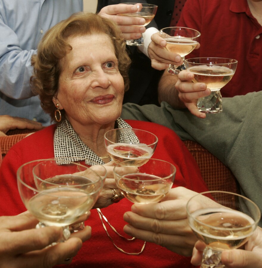 Maria Altmann celebrates with family members in 2006 after an Austrian arbitration court determined the country is legally obligated to return the Gustav Klimt paintings to her.