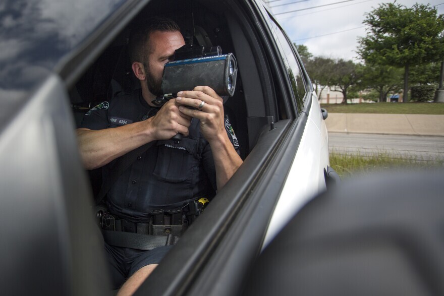  An Austin police officer scanning U.S. 183 for speeding drivers in 2015. 