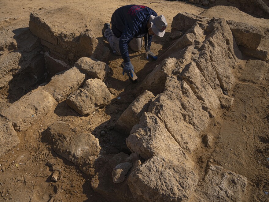 A member of a Palestinian excavation team works in a newly discovered Roman era cemetery in the Gaza Strip on Sunday.