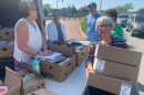 Left to right: Chris Lavenets, Rachel Todoroff, Deke Knight, Carol Flynn (partially obscured), and Kathy Kurniawan delivering in Hyannis.