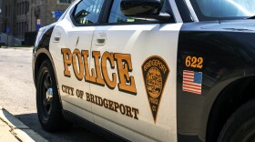Patrol car parked outside of the police department headquarters on Wednesday, July 26, 2023 in Bridgeport, Conn.