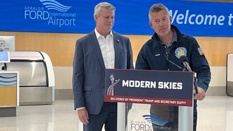 Congressman Bill Huizenga looks on as U.S. Transportation Secretary Sean Duffy speaks at Grand Rapids' Ford Airport Wednesday