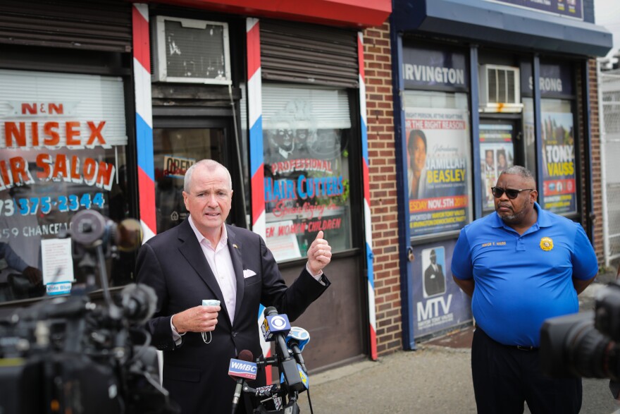 Governor Phil Murphy and Irvington Mayor Tony Vauss at the Pop-up Barber Shop Vaccination Site in Irvington on Friday, June 11, 2021.