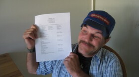 Bennett Ely shows off his resume. He's hoping to find work after he lost his $261 general assistance benefit from the state Saturday.