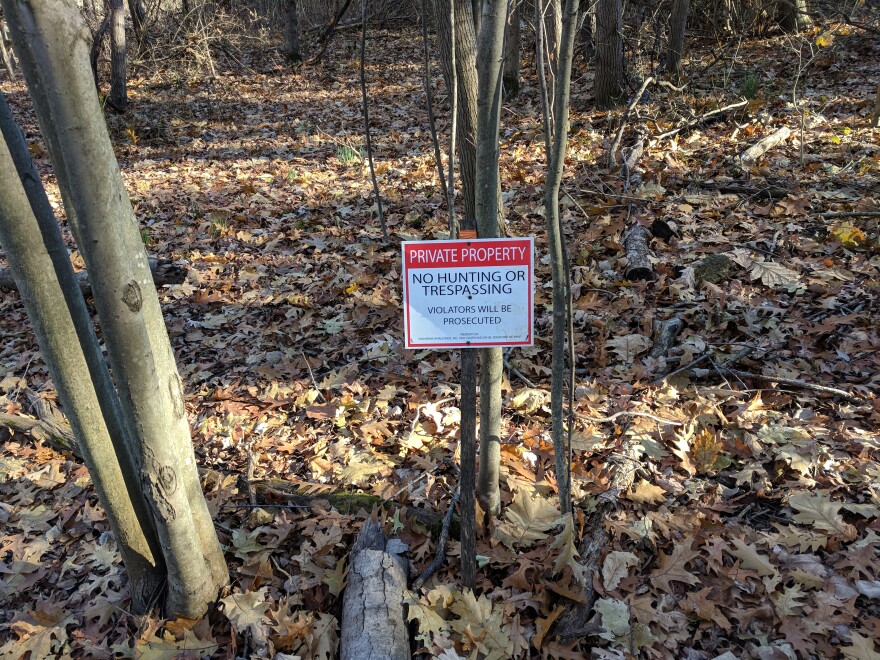 A "no trespassing" sign from the House Street site boundary.