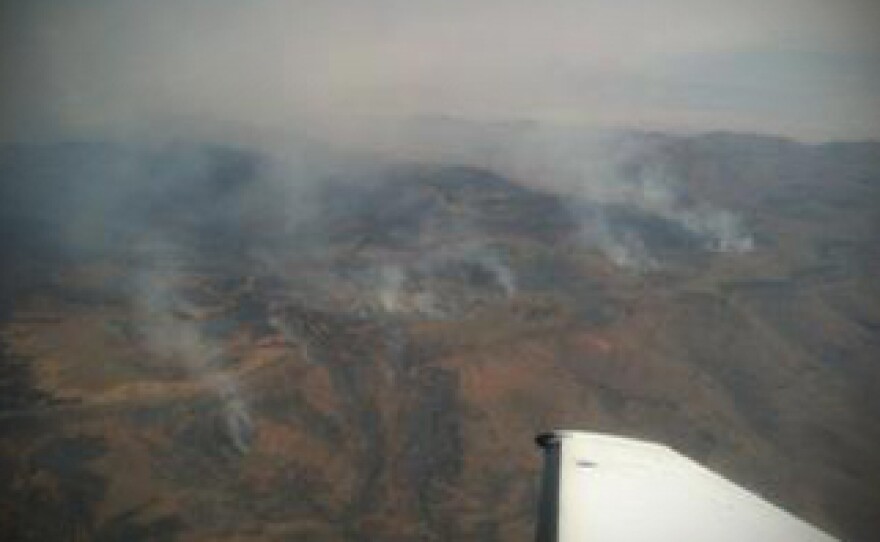 Gov. Brian Sandoval on Sunday toured parts of Northern Nevada devastated by 15 wildfires burning throughout the region.