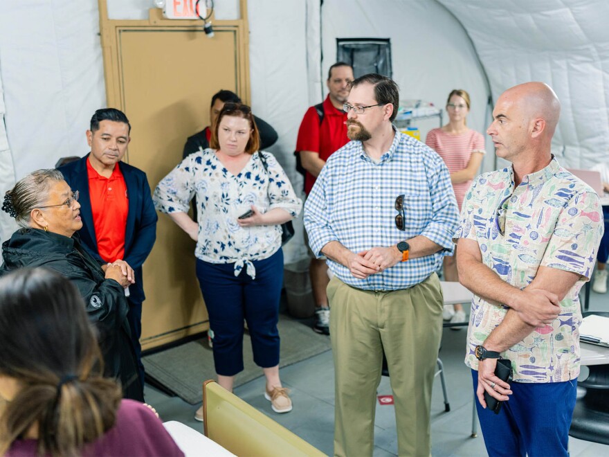 Helmsley Charitable Trust Trustee Walter Panzirer, Rural Healthcare Program Director Wayne Booze and Program Officer Elizabeth Ruen listen as Northern Marianas College Nursing Department Chair Rosa Aldan explains lab equipment during a recent site visit.