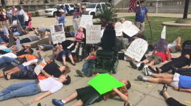 Die In outside the Indianapolis office of U.S. Sen. Todd Young.