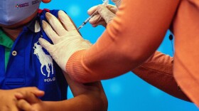 A 6 year old child receives the Pfizer-BioNTech Covid-19 Vaccine for 5-11 year old kids at Hartford Hospital in Hartford, Connecticut on Nov. 2, 2021. (Joseph Prezioso/AFP via Getty Images)
