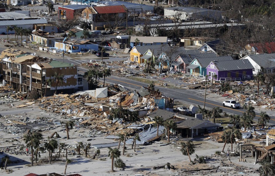 FILE - In this Oct. 12, 2018 file photo debris from homes destroyed by Hurricane Michael litters the ground in Mexico Beach, Fla. Michael was among the strongest hurricanes ever to make landfall in the United States. (AP Photo/Gerald Herbert, File)