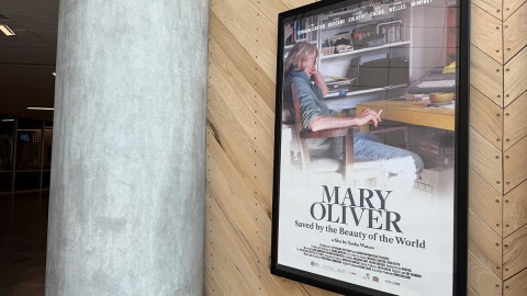 A poster for the documentary is displayed FilmScene. 