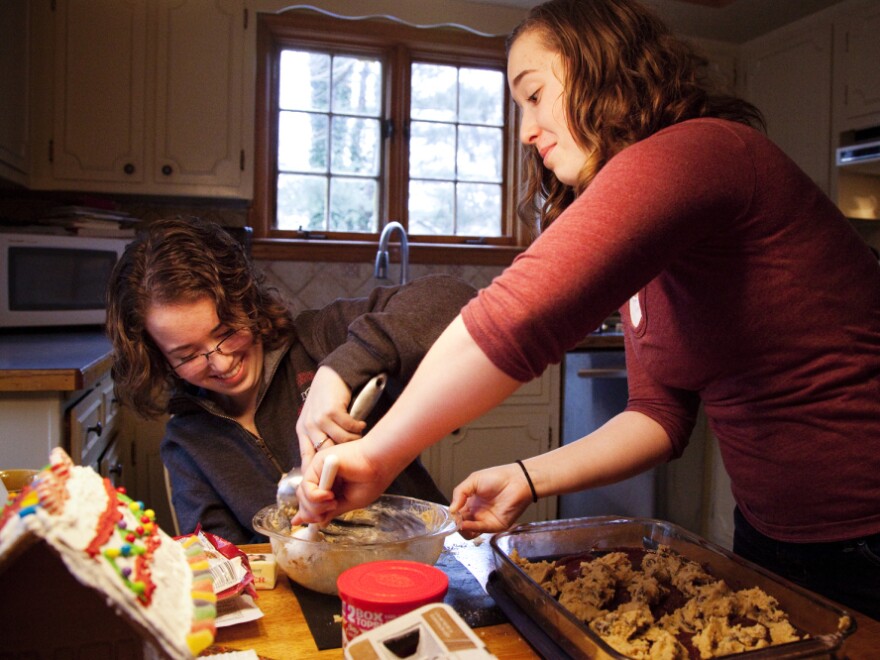 Laurel and her twin sister Heather bake together at their home in North Attleboro, Mass., on Friday, December 23, 2011.