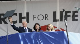 Vice President Mike Pence, with his wife Karen Pence, center, waves while speaking at the March for Life on the National Mall in Washington. (Manuel Balce Ceneta/AP)