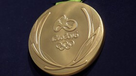 A close-up of the Olympic gold medal for the 2016 Summer Games in Rio. (Alexandre Loureiro/Getty Images)