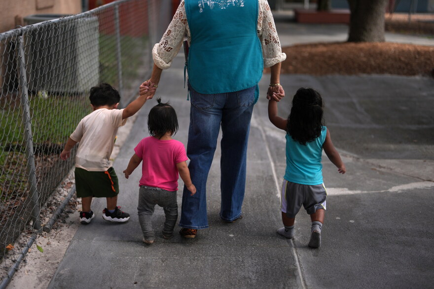 A teacher escorts young children back to their classroom at a Head Start preschool in Immokalee, Fla., Thursday, Sept. 10, 2026.