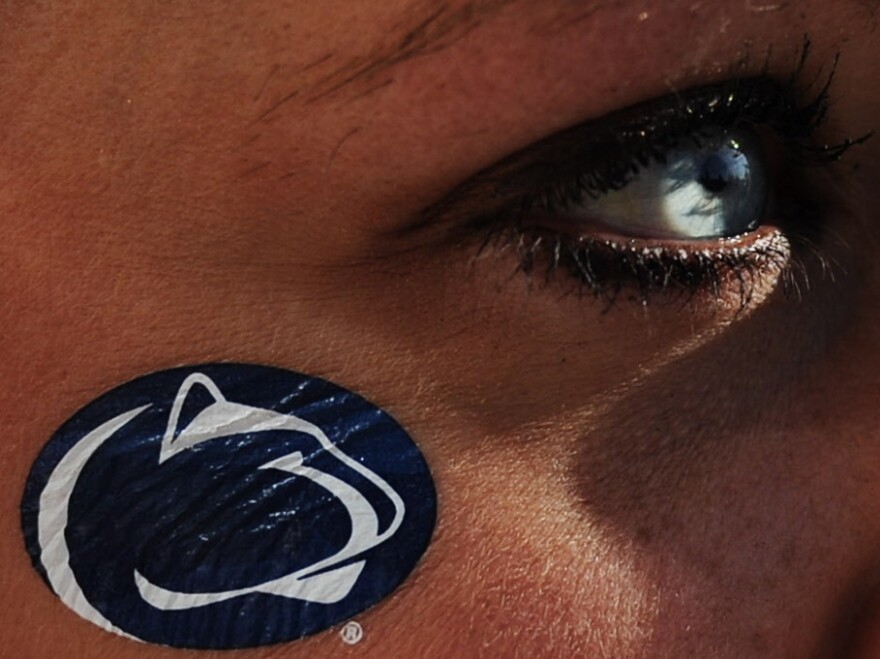 During Saturday's game against Nebraska, a Penn State fan looks on in State College, Pa.