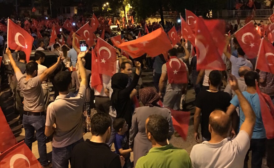 Volunteers from Project Refugee Smile watch Turkish residents take to the street during the coup.  