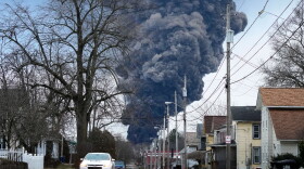 A black plume rises over East Palestine, Ohio, as a result of a controlled detonation of a portion of the derailed Norfolk Southern trains, on Feb. 6, 2023. (Gene J. Puskar/AP)
