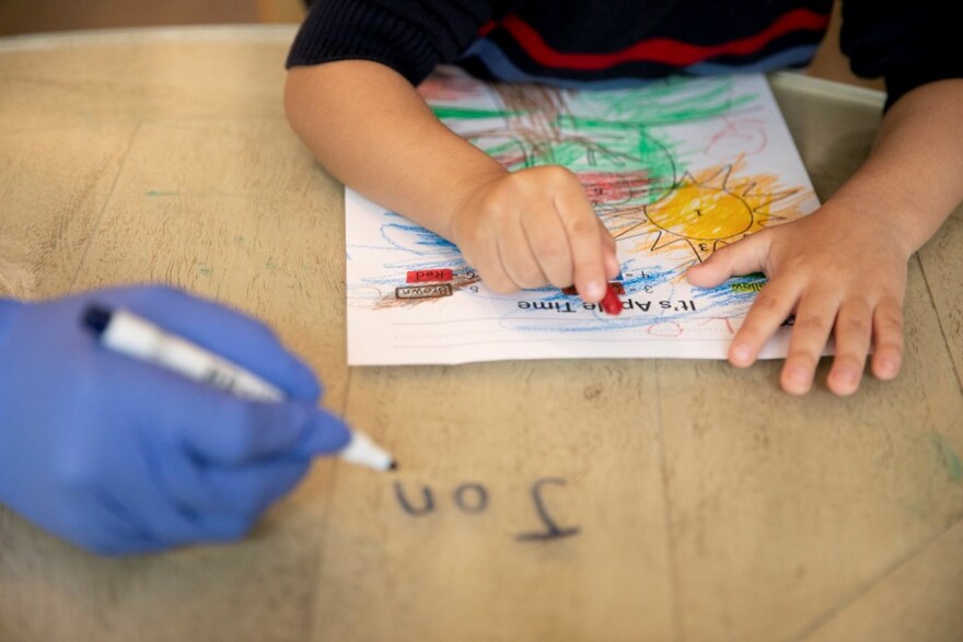 Jonathan, 4, works on a coloring activity during online preschool at his home in Tracy on March 3, 2021. Jonathan, who is on the autism spectrum, is aided by a one-on-one therapist three days a week who helps with online learning and behavioral issue