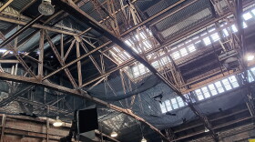 The interior of the Broadway Barns in downtown Buffalo, seen in April 2026. Debris which had fallen from the ceiling could be seen captured in netting set up to prevent objects from falling to the ground below.