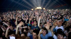 People dance during a concert of French electro band C2C as part of the 37th edition of 'Le Printemps de Bourges' rock and pop festival in the French city of Bourges.
