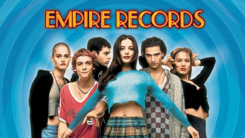 a still image of men and women posing with the words Empire Records
