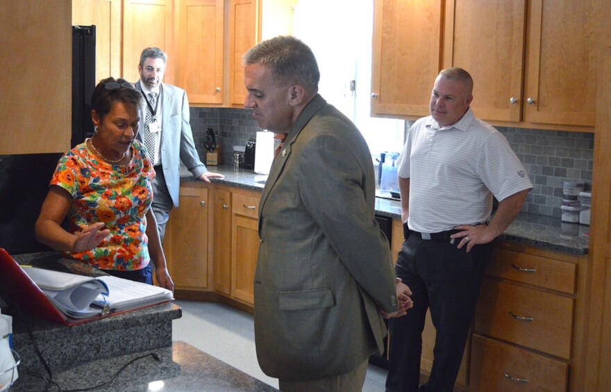 State Rep. Eric Berthel tours an Oak Hill home in Watertown, Connecticut in 2016.