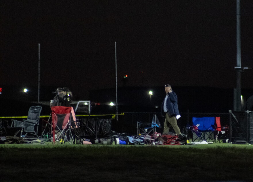 Investigators look over the scene at Stryker Sports Complex on Saturday after a truck drove onto the soccer field, killing two people.