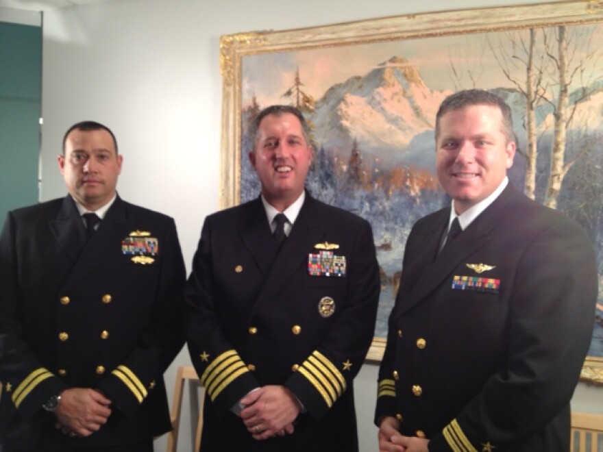 (From left to right) Lieutenant Todd Kamins, Captain Brian Quin who will be the commanding officer of the vessel and Lieutenant Commander Kevin Friel. Photo by Lori Townsend, APRN - Anchorage.
