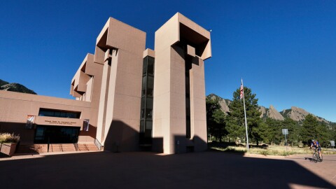 A large sandstone colored building.