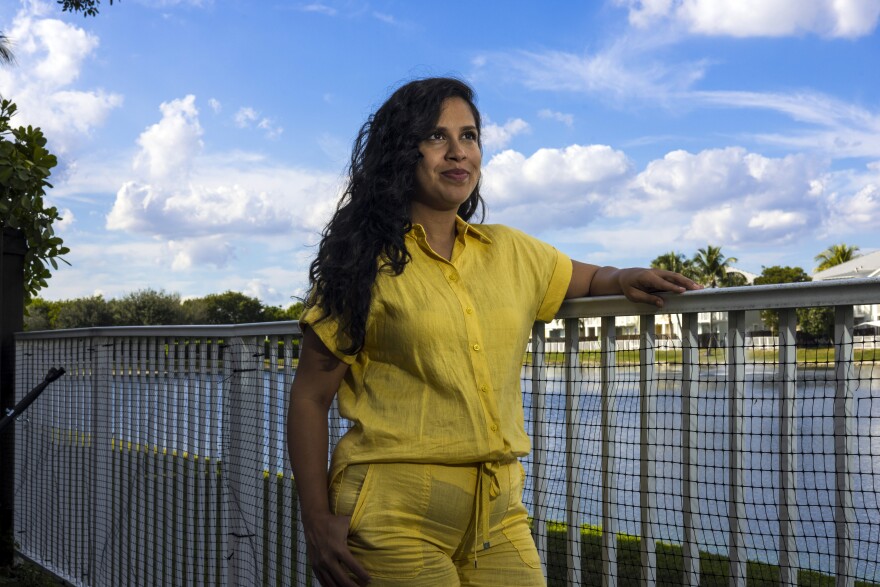 Woman poses by a canal