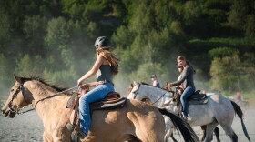 Ailey Hiner (left) rides with Naamah North (right) and others during a drill team practice on Sep. 2