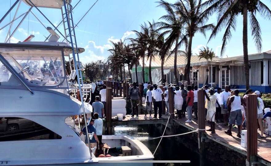 Fisherman unload supplies after traveling to the Bahamian islands from Florida. Photo: Paul Brinkmann / UPI